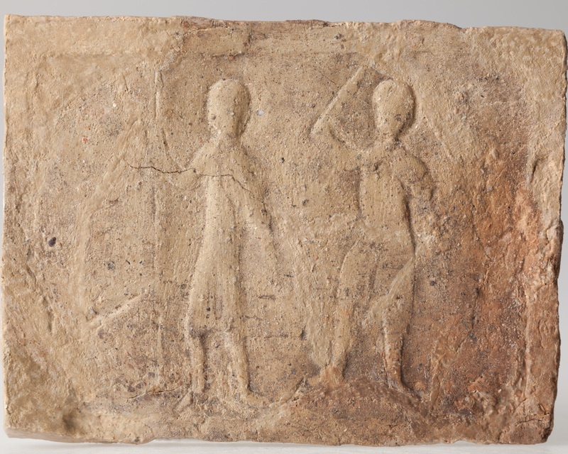 Płytka z wyobrażeniem wojowników