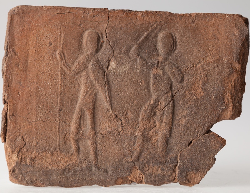 Płytka z wyobrażeniem wojowników