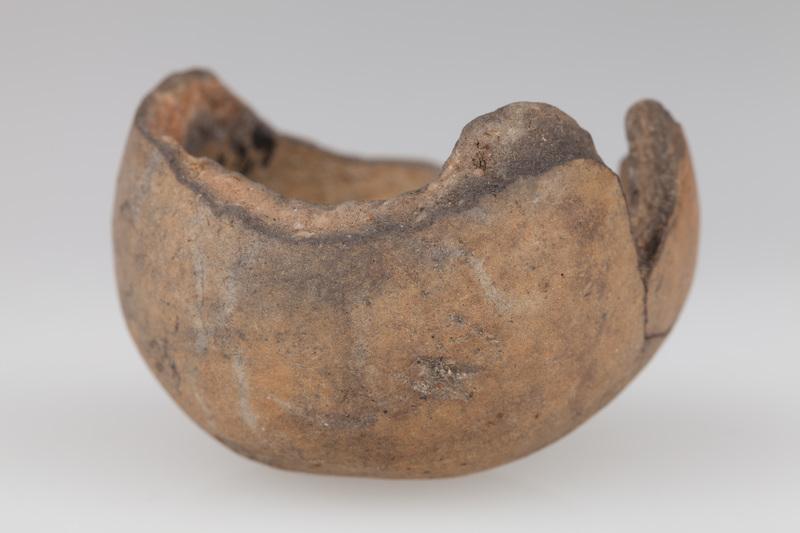 Fragment grzechotki gruszkowatego kształtu