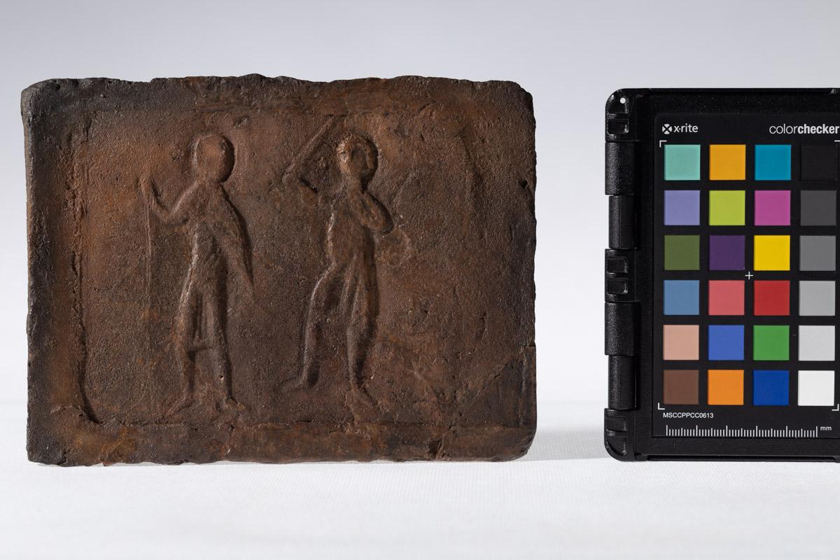 Płytka z wyobrażeniem wojowników