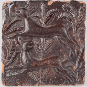 Kafel z parą uciekających zajęcy