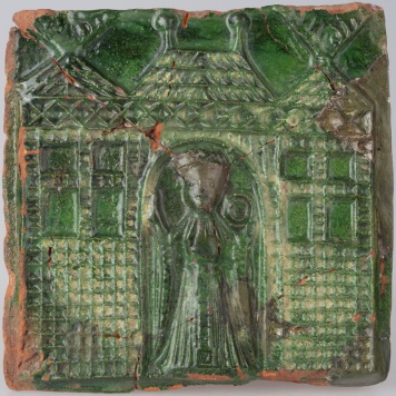 Kafel z postacią kobiety w arkadzie zamku z okrągłym przedmiotem w dłoni