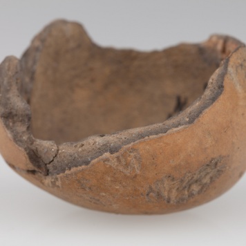 Fragment grzechotki gruszkowatego kształtu